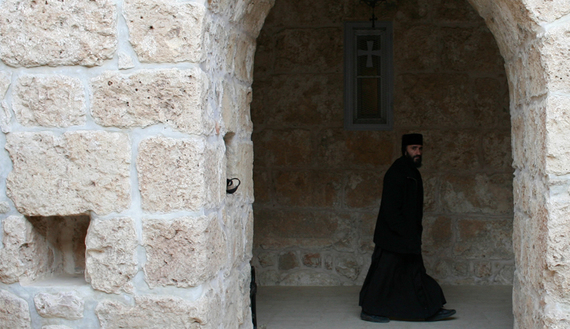 A Syriac Christian monk walks to attend a service at the ancient monastery of Mor Gabriel, near the town of Midyat, in southeast Turkey, Jan. 13, 2009.